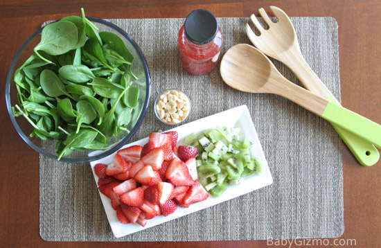 spinach salad ingredients on grey mat