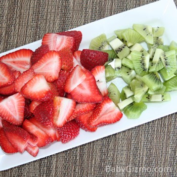 strawberries and kiwi cut on a plate
