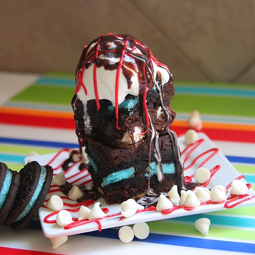 brownie sundae on a white plate on colorful mat
