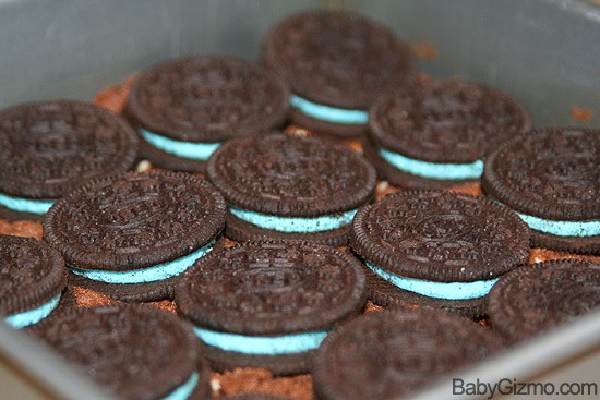 close up of blue spring oreos on brownie batter