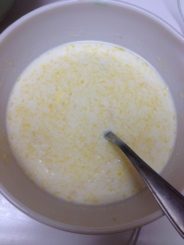 egg milk vanilla and melted butter in bowl