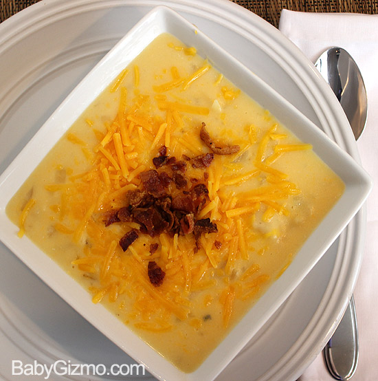 Potato Soup in white bowl on plate