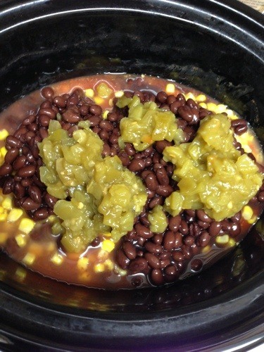 green chilis on beans in crockpot