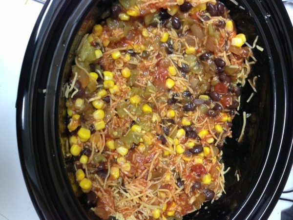taco and cheese on chicken in crockpot