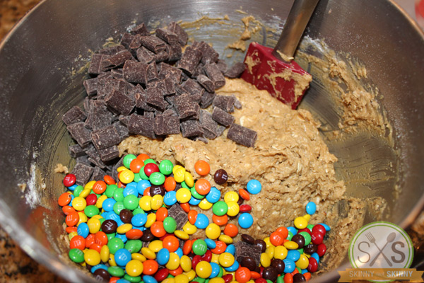 m&ms chocolate with peanut butter dough in metal bowl