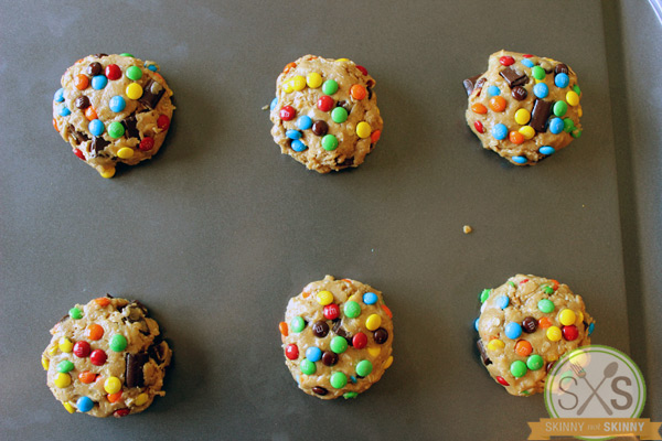 Six Monster cookie dough balls on cookie sheet