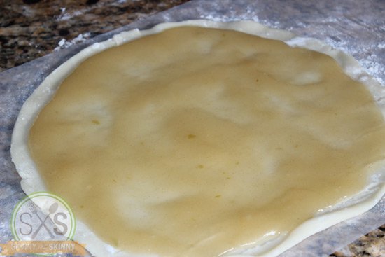 apple pie filling spread on pie crust